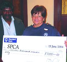 Denise Beattie from the SPCA receiving the R7000 cheque from Mags Anthony, chairman of ESDA